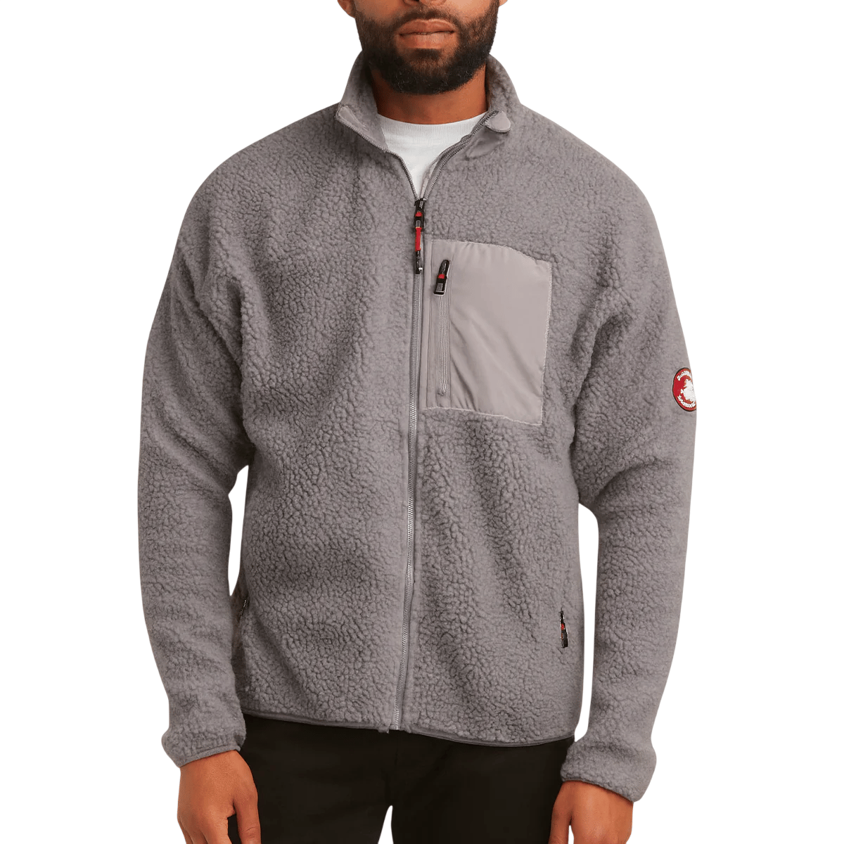 A gray fleece jacket with a full zipper, featuring a zippered chest pocket and a patch logo on the sleeve.
