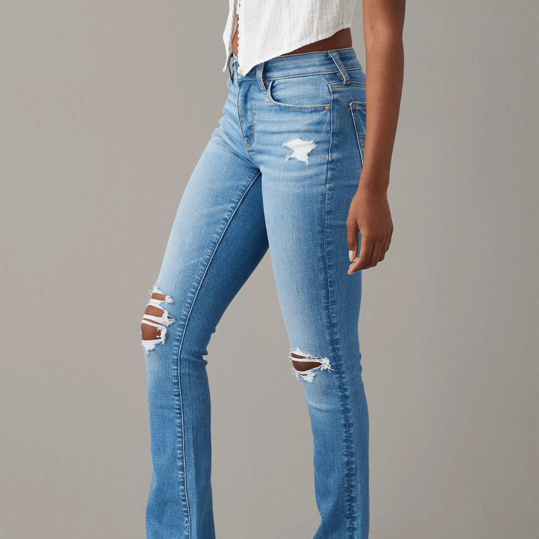 Light blue ripped skinny jeans with a white top.