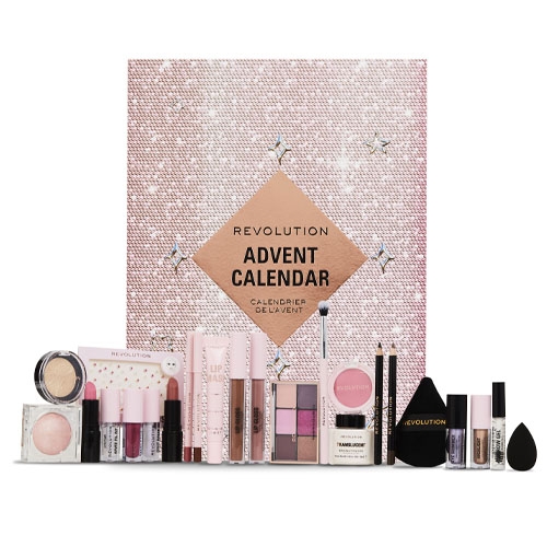 a variety of beauty products in front of a pink box