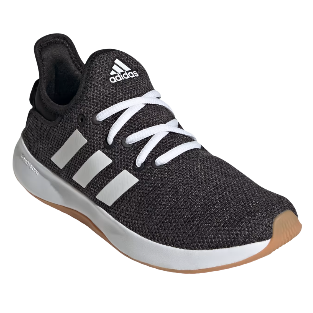 A black Adidas running shoe with a white logo, three side stripes, white laces, and a white midsole with a gum rubber outsole.