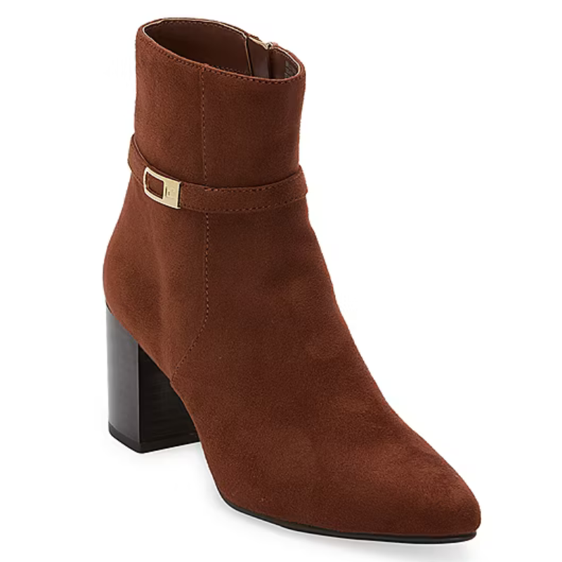 Brown suede ankle boot with a block heel, featuring a decorative strap with a small gold buckle detail.