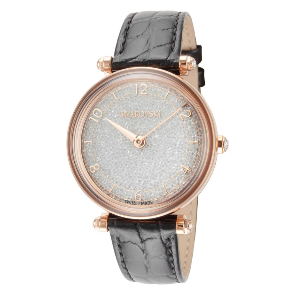 Swarovski watch with a rose gold-tone case, sparkling crystal-studded dial, and black textured leather strap. Swiss-made design.