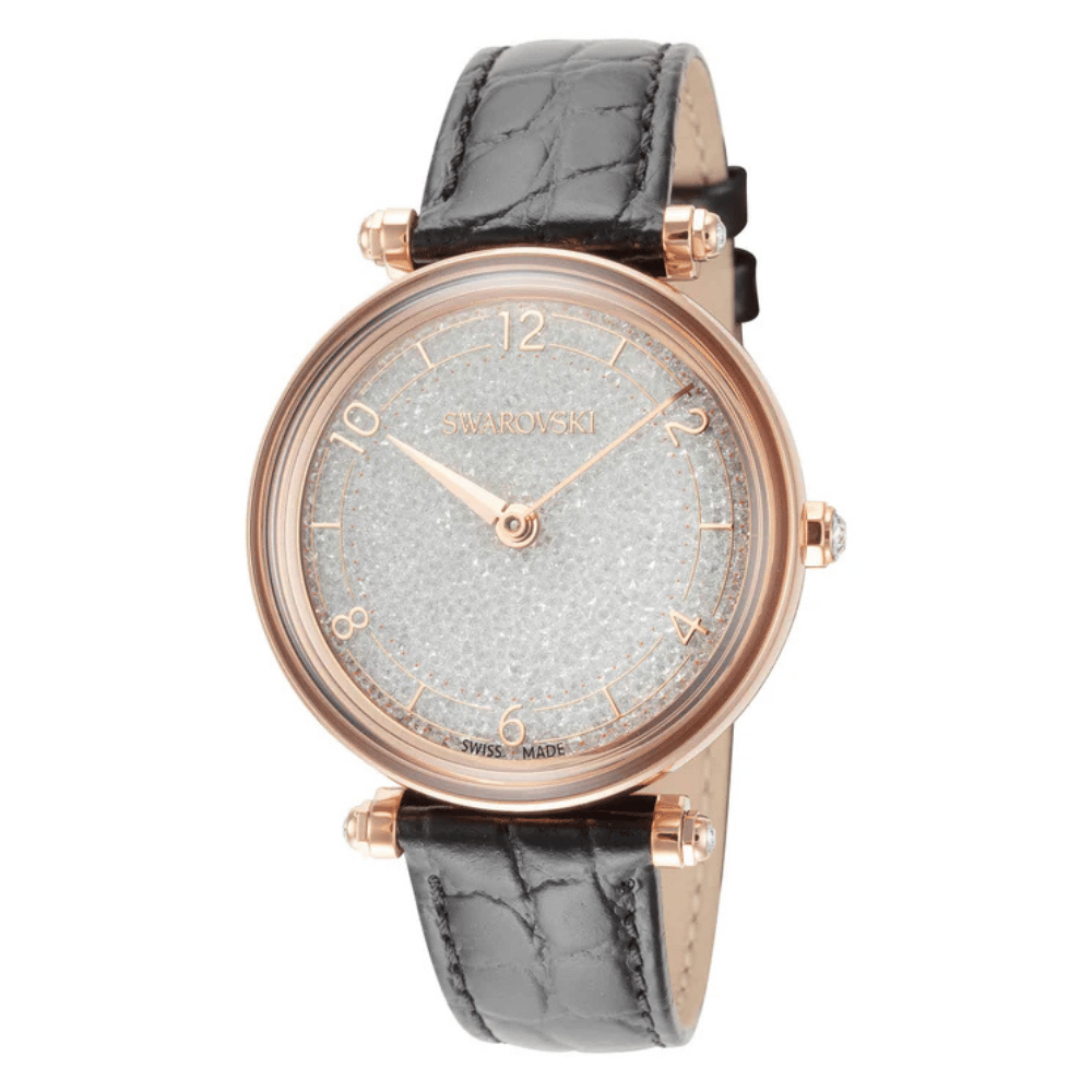 Swarovski watch with a rose gold-tone case, sparkling crystal-studded dial, and black textured leather strap. Swiss-made design.