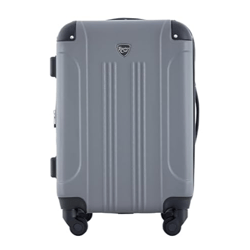 A gray hard-shell suitcase with four spinner wheels and a top handle, featuring a small badge logo on the front.
