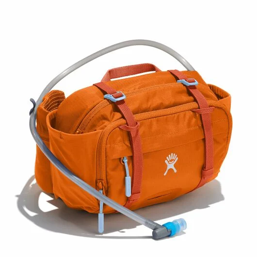 An orange hydration pack with a built-in water hose and storage compartments.