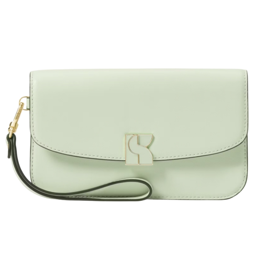 A light green Kate Spade flap wristlet with a sleek design features a gold-tone logo clasp and a detachable wrist strap for versatile carrying.