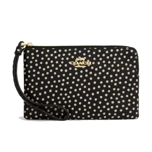 A black wristlet with a white polka dot pattern featuring a gold Coach logo and a zip closure.