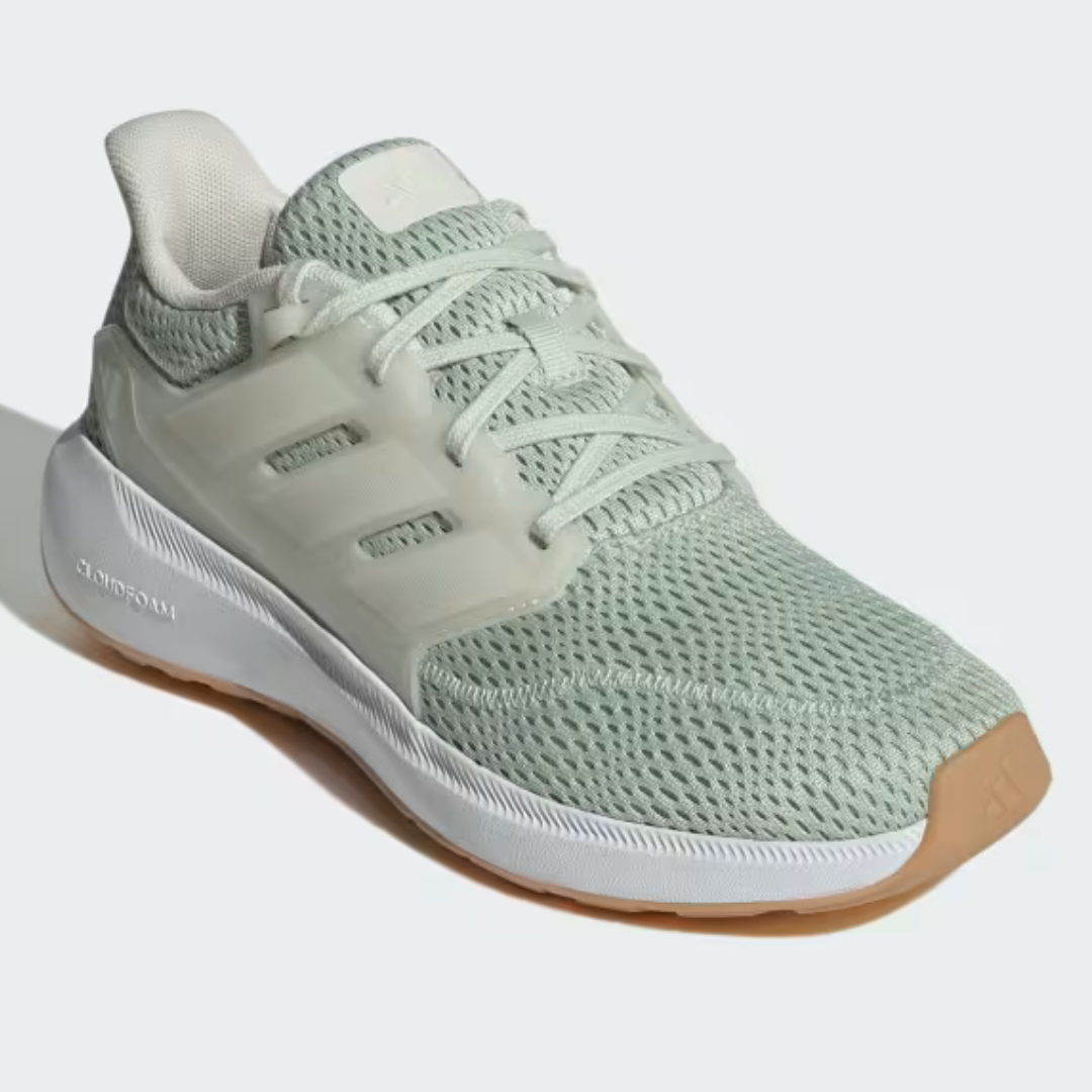 A mint green running shoe with white \“CLOUDFOAM\“ text on the side and a gum-colored sole.