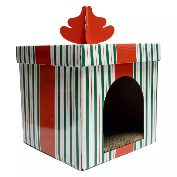 Festive pet hideaway resembling a wrapped gift box with red and green stripes, featuring an open arch entrance and a decorative top.