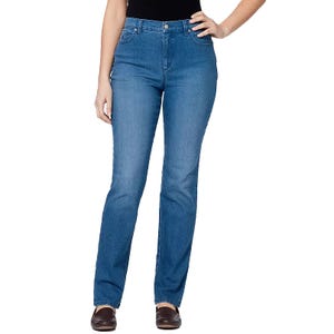 A person is wearing blue straight-leg jeans paired with brown loafers and a black top.