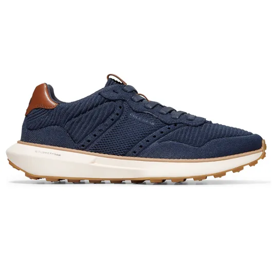 Navy blue sneaker with mesh upper and leather accents, featuring a white midsole and gum outsole.
