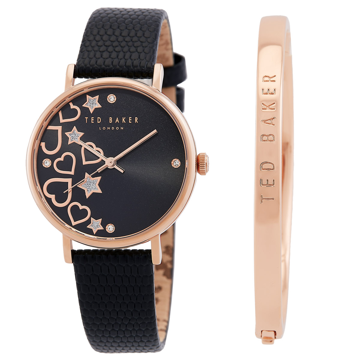 Ted Baker watch with a black dial featuring heart and star designs, and a black textured strap, accompanied by a rose gold bangle engraved with \“Ted Baker\“.