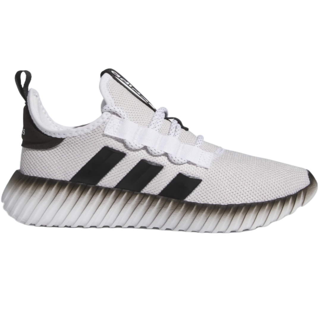 A white Adidas sneaker featuring a ribbed sole and three black stripes on the side, with a pull tab on the heel and a mesh upper design.