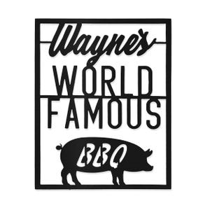 Black metal wall sign with \“Wayne's World Famous BBQ\“ text, featuring a silhouette of a pig.