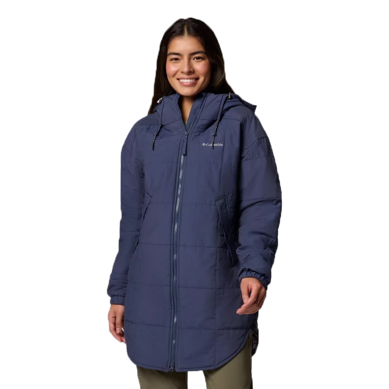 A person is wearing a Columbia-branded long, blue puffer jacket with a hood, featuring a quilted design and zipper closure.