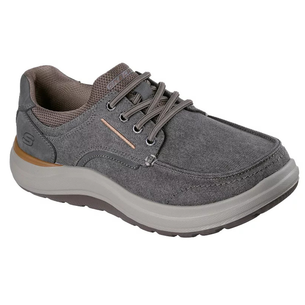 Gray casual sneaker with a lace-up front, cushioned sole, and textile upper material, featuring subtle stitching details and branding.
