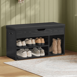 VASAGLE home entryway features a black shoe bench with multiple shelves for shoe storage and a cushioned seat, alongside a wall coat rack with a hat and scarf hanging.