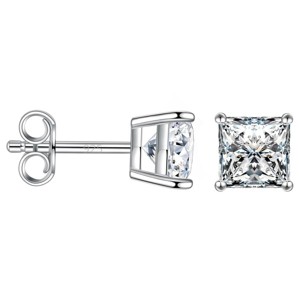 A pair of square-cut moissanite studs with a four-prong setting, featuring clear, sparkling gemstones set in silver-toned metal. They have a classic push-back closure and the metal is marked with \“925,\“ indicating sterling silver.