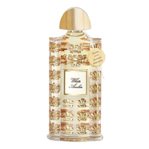 Creed White Amber fragrance, featuring intricate gold detailing and a label stating \“Gilded with 10-karat fine gold.\“