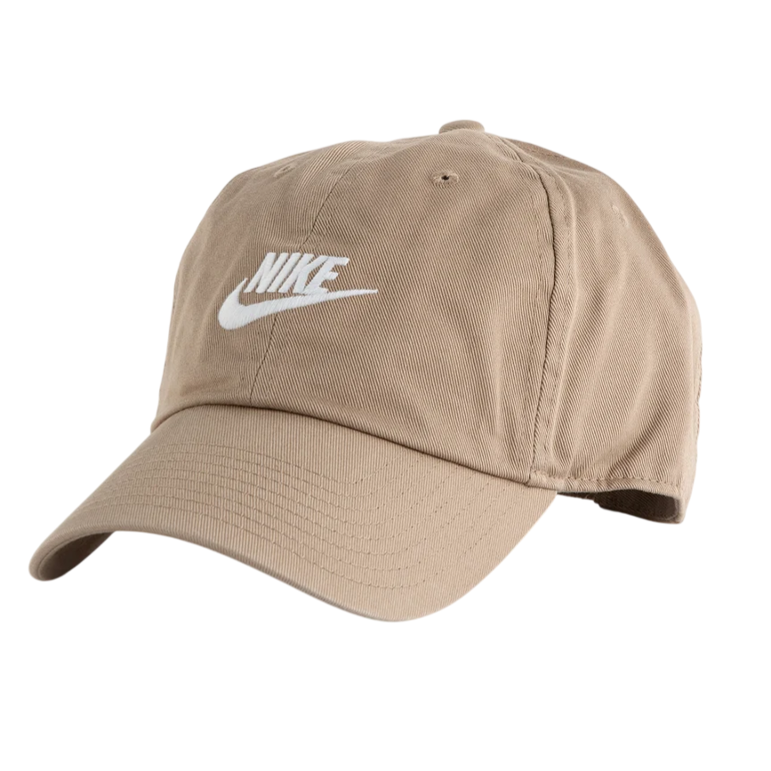 Tan Nike baseball cap with an embroidered white logo on the front, featuring a curved brim and adjustable strap at the back.