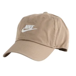 Tan Nike baseball cap with an embroidered white logo on the front, featuring a curved brim and adjustable strap at the back.