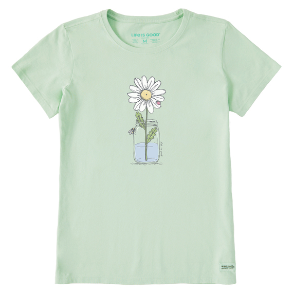 Light green t-shirt featuring a simple graphic of a daisy in a jar with water. The design is minimalist with a cheerful and clean aesthetic.