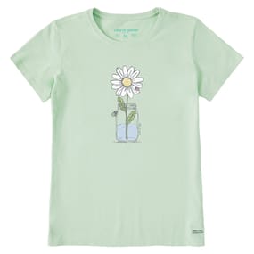 Light green t-shirt featuring a simple graphic of a daisy in a jar with water. The design is minimalist with a cheerful and clean aesthetic.