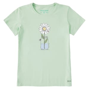 Light green t-shirt featuring a simple graphic of a daisy in a jar with water. The design is minimalist with a cheerful and clean aesthetic.