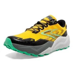 A Brooks running shoe featuring a yellow and black design with turquoise accents, a thick cushioned sole, and green tread.