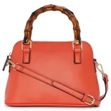 A vibrant orange handbag featuring a bamboo-style handle and an adjustable strap.