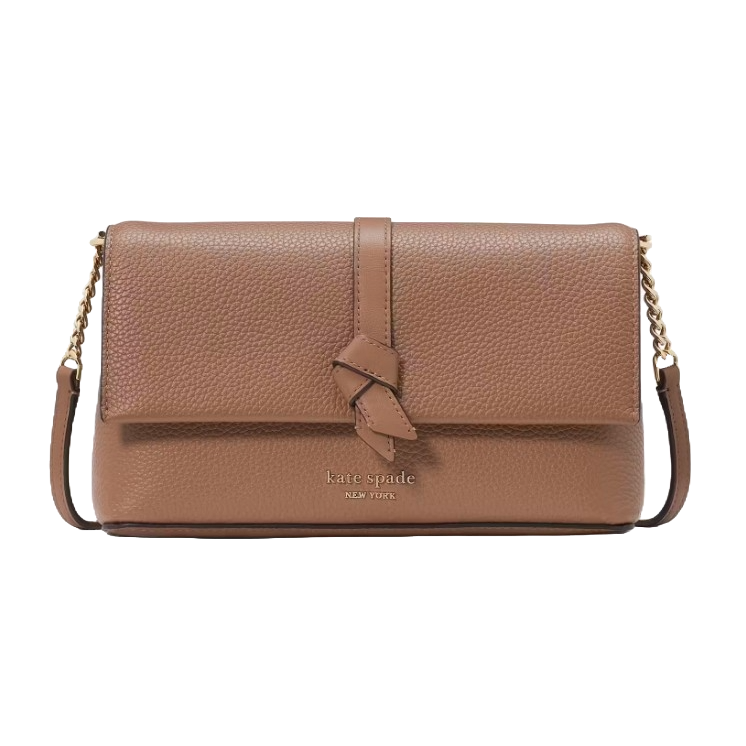 A tan leather crossbody bag featuring a knotted flap closure, gold chain strap, and \“kate spade NEW YORK\“ embossed logo on the front.