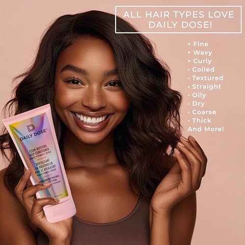 A woman smiles while holding a bottle of Daily Dose Cream Moisture Leave-In Conditioner, suitable for various hair types such as fine, wavy, curly, coiled, textured, straight, oily, dry, coarse, and thick.