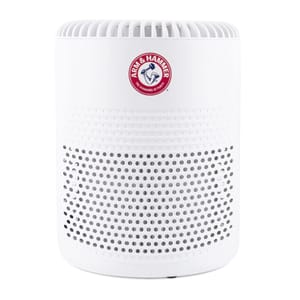 A white Arm & Hammer air purifier featuring a perforated casing and the brand's logo on the front.
