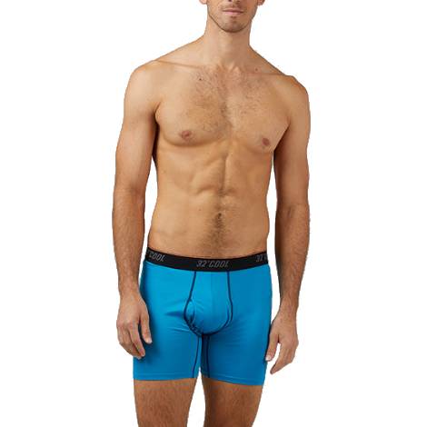 A male model wearing bright blue boxer briefs with a black waistband labeled \“32 COOL.\“