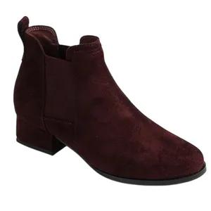 A burgundy suede ankle boot with a low block heel and elastic side panel for easy slip-on.