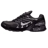 The Nike Air Max Torch 4 shoes have a black mesh and synthetic upper with a metallic silver Swoosh logo, featuring visible Air cushioning in the heel for comfort and a sporty design.