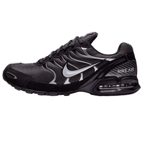The Nike Air Max Torch 4 shoes have a black mesh and synthetic upper with a metallic silver Swoosh logo, featuring visible Air cushioning in the heel for comfort and a sporty design.