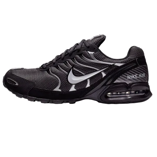 The Nike Air Max Torch 4 shoes have a black mesh and synthetic upper with a metallic silver Swoosh logo, featuring visible Air cushioning in the heel for comfort and a sporty design.