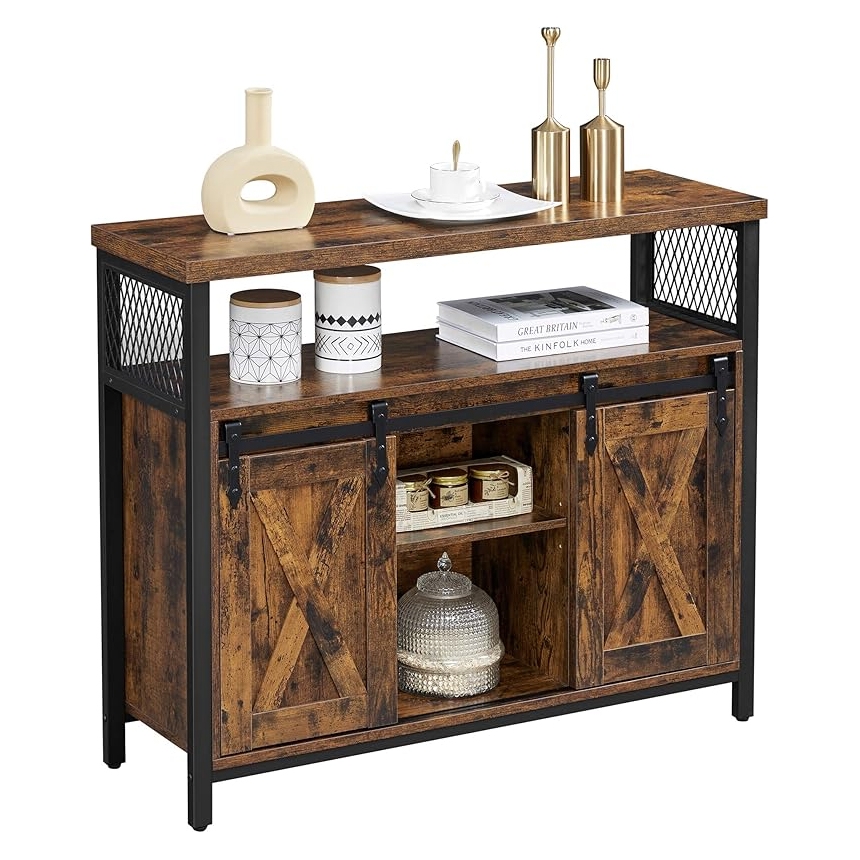 A rustic console with a metal and wood design featuring two sliding barn doors, open shelving, and decorative items on top.