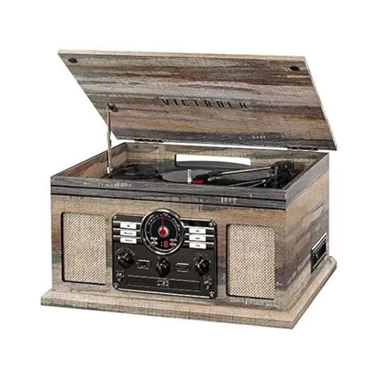 A vintage-style Victrola wooden record player with a hinged lid, equipped with radio and control knobs on the front, complemented by built-in speakers.