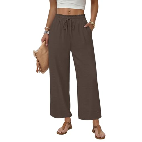 The image shows a person wearing brown wide-leg pants with an elastic waistband and drawstring. They are accessorized with sandals, bracelets, and a clutch.