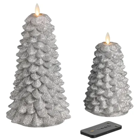 Two glittery, silver, LED wax candles shaped like Christmas trees with a remote control, featuring flickering flame effects.