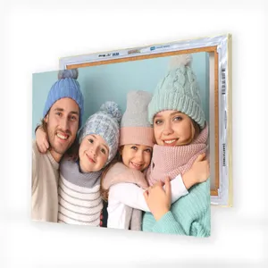 Two wrapped canvas prints featuring a family in winter attire, showcasing cozy knit hats and scarves in pastel colors.