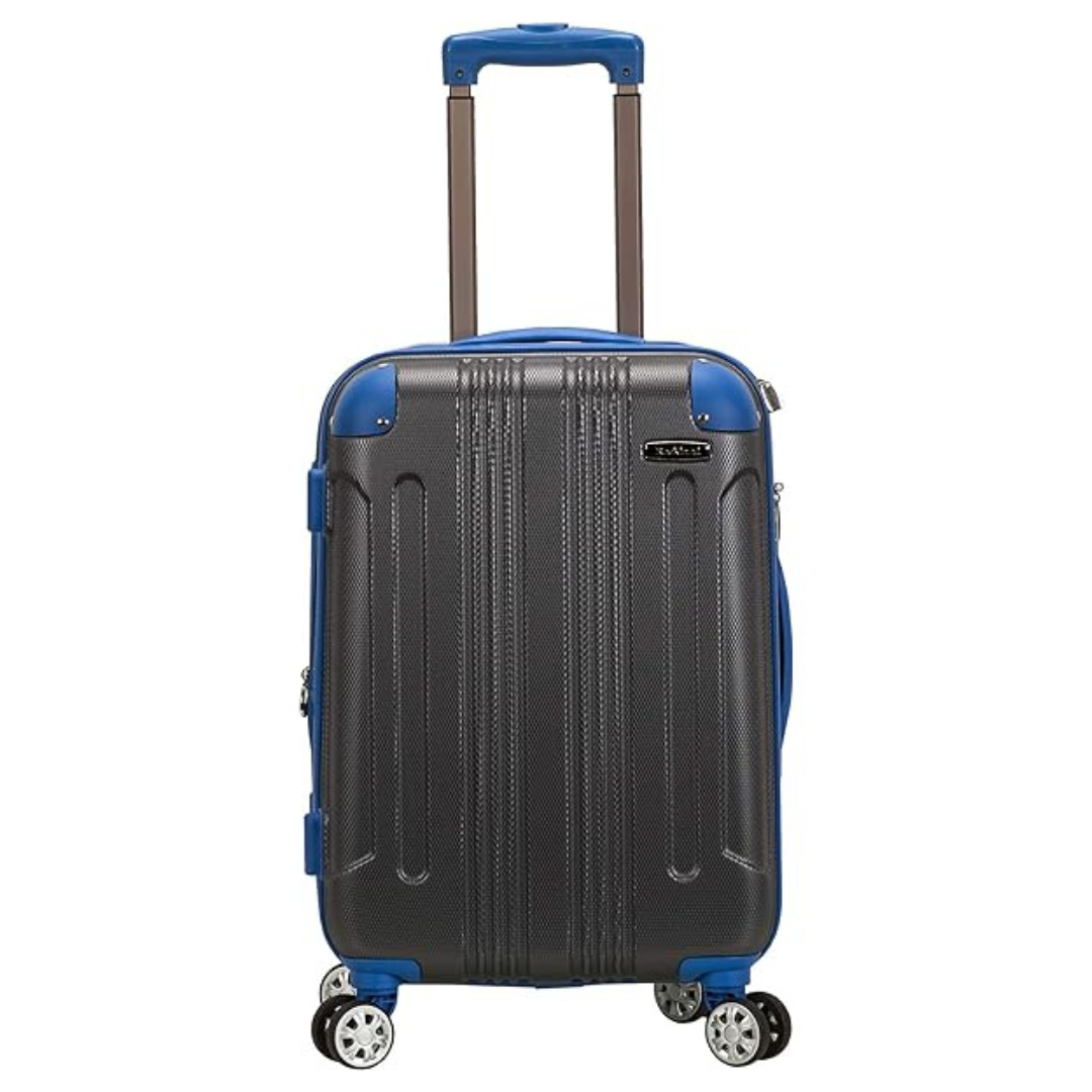 A gray hard-shell suitcase with blue accents, featuring four spinner wheels and a telescopic handle.