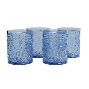 Set of four light blue drinking glasses with intricate embossed patterns, featuring a vintage-inspired design and cylindrical shape.
