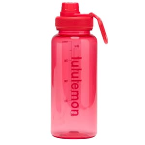 Red Lululemon water bottle with a screw cap, carrying loop, and measurement markings on the side.