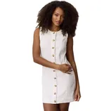 A woman is wearing a sleeveless, button-front, cream-colored mini dress.