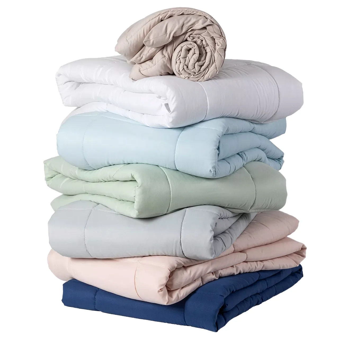 A stack of folded comforters in various colors, including beige, white, blue, green, gray, pink, and navy.