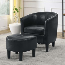 Black leather barrel chair with matching ottoman.