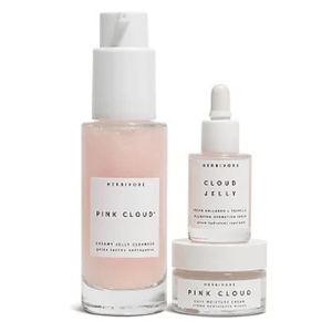 Herbivore Pink Cloud set includes a Creamy Jelly Cleanser, Cloud Jelly Plumping Hydration Serum, and Soft Moisture Cream, all in a light pink hue.